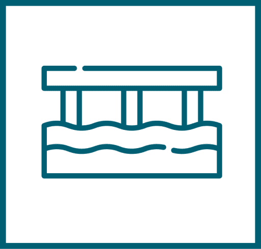 Simple line drawing of a bridge with three supports crossing over water, shown in a square blue-green outline.