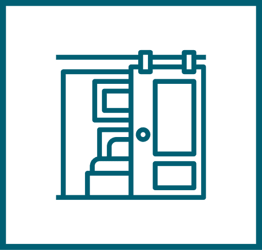 Line drawing of a sliding barn door partially open, revealing a room with a bed and framed pictures on the wall.